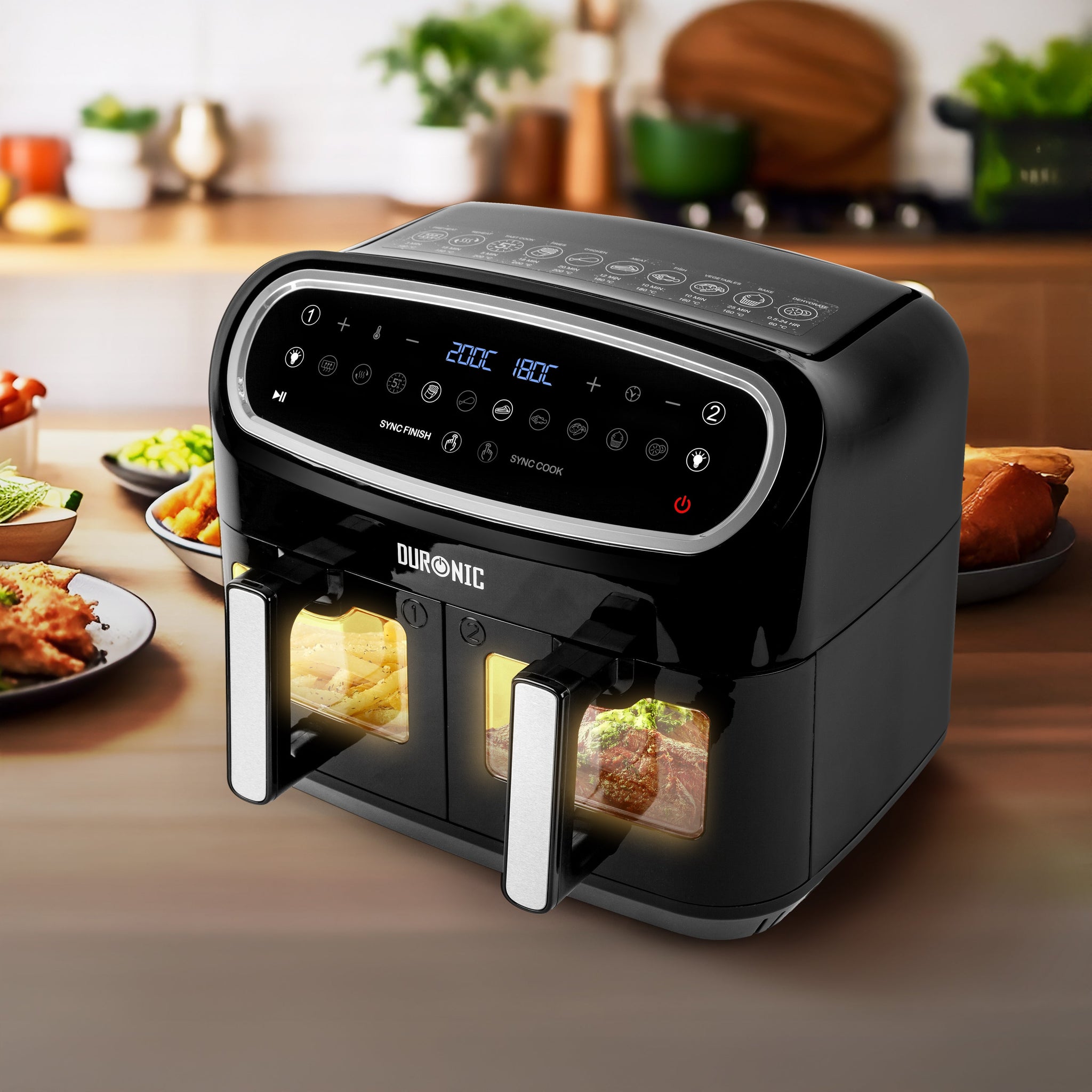 Duronic AF34 BK XXL air fryer placed on an aesthetic kitchen countertop surrounded by different dishes