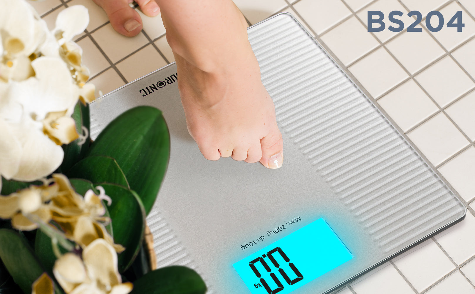 Duronic BS204 digital bathroom scale calibrating weight on a tile floor