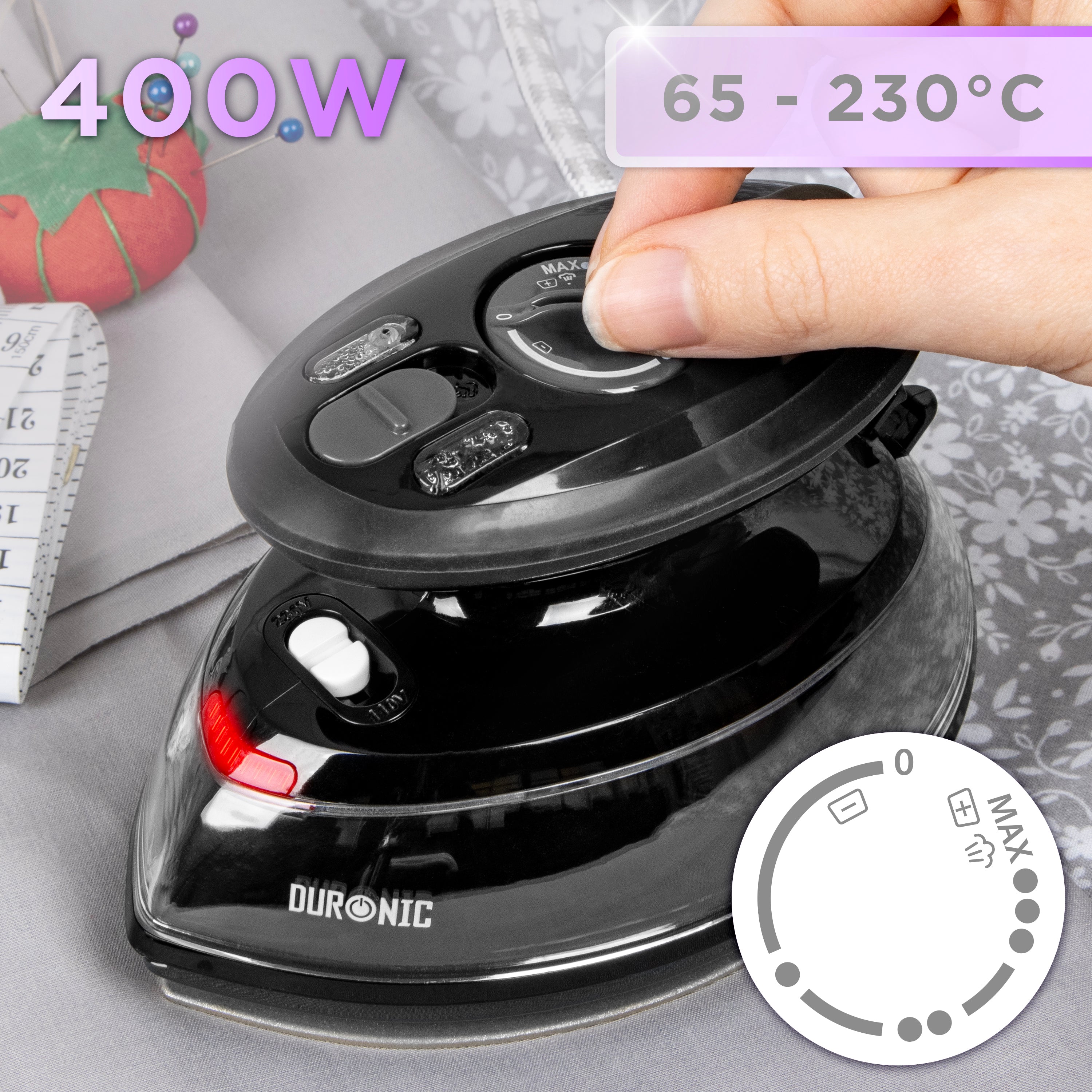 Duronic Black Travel Iron with an adjustable temperature dial ranging from 65°C to 230°C, shown next to sewing supplies
