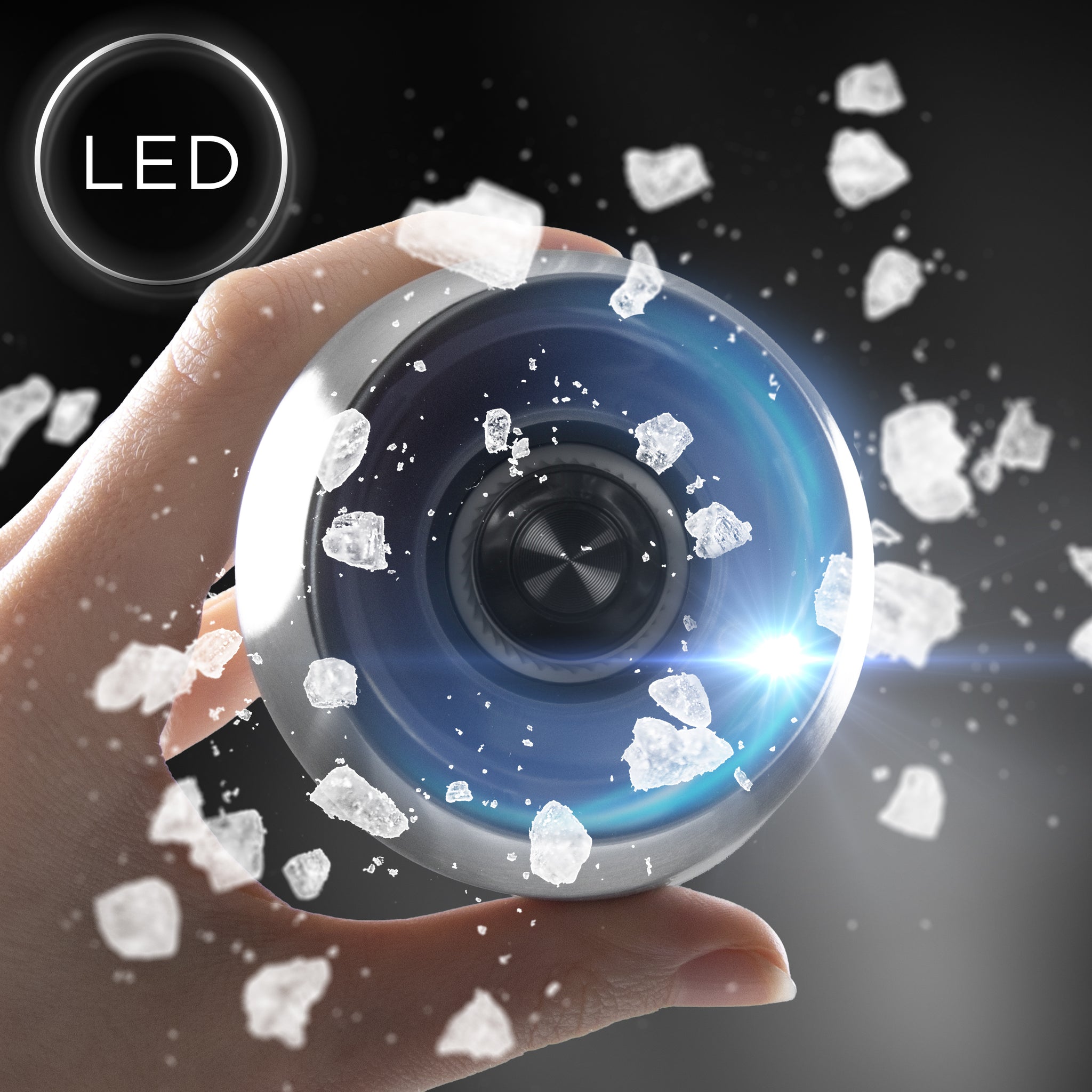 Duronic Electric Salt and Pepper Grinder Set surrounded by floating ice crystals on dark background.