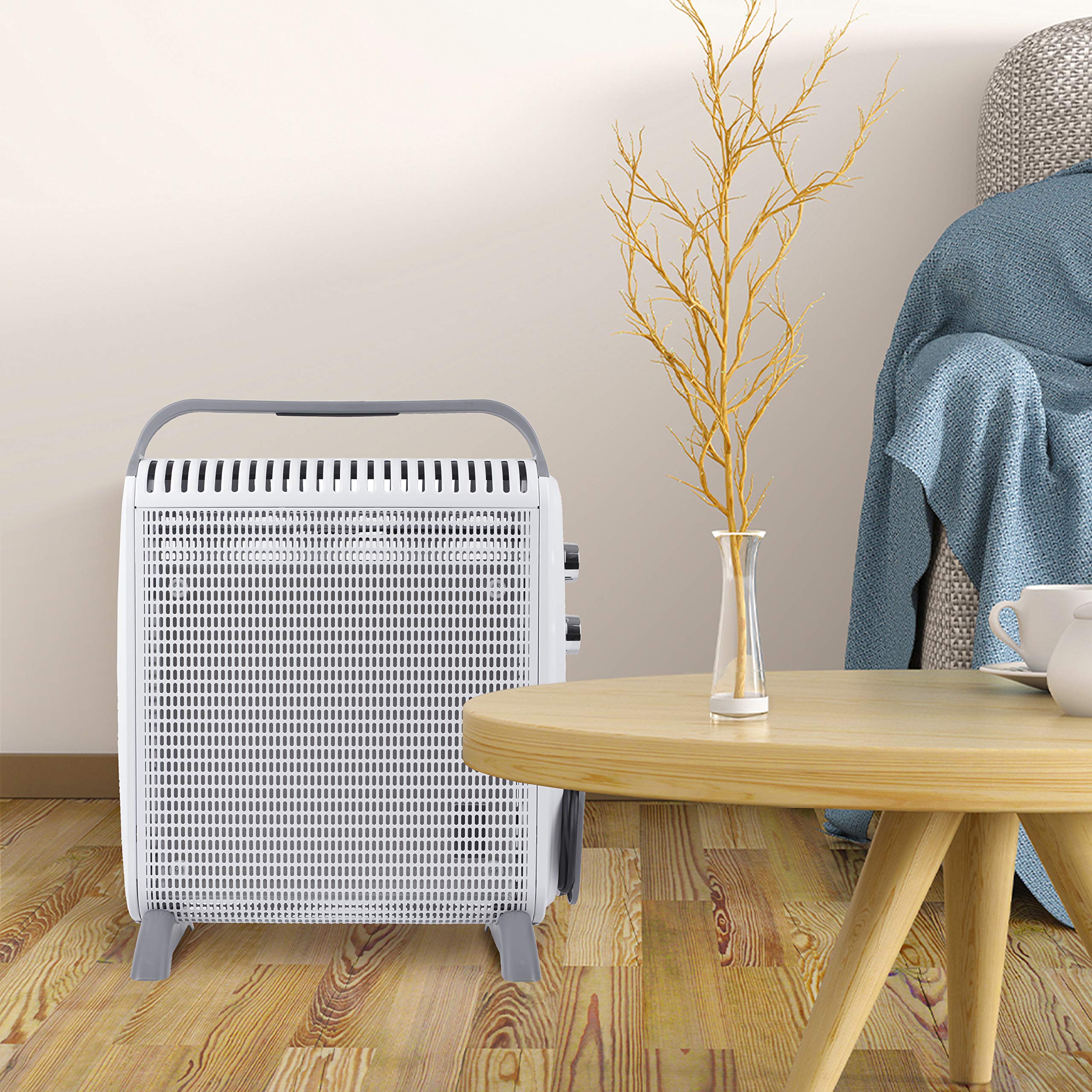 Duronic Electric Heater standing on a wooden floor next to a table.