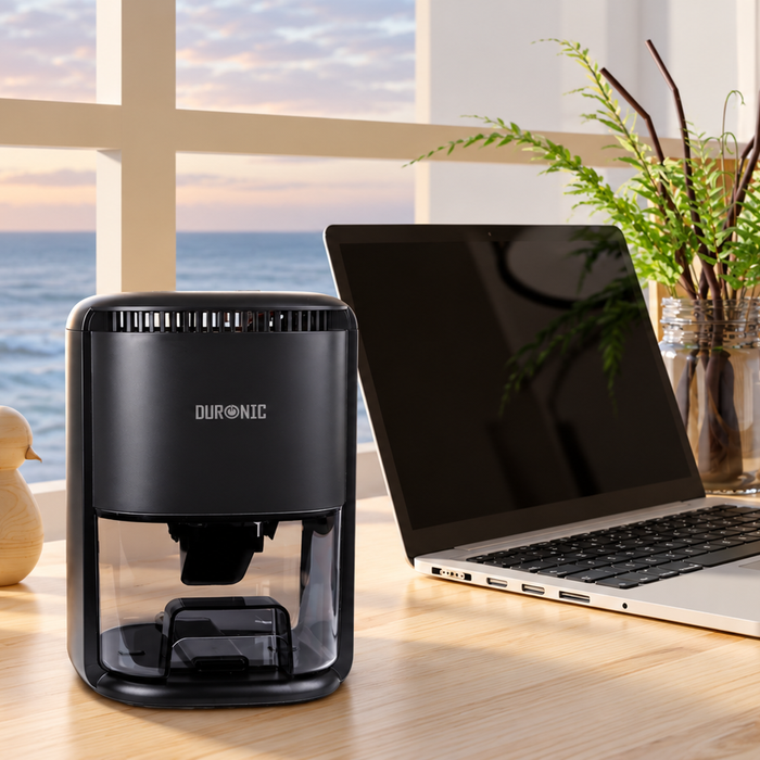 Duronic DH07 BK mini dehumidifier in use in an aesthetic desk setting