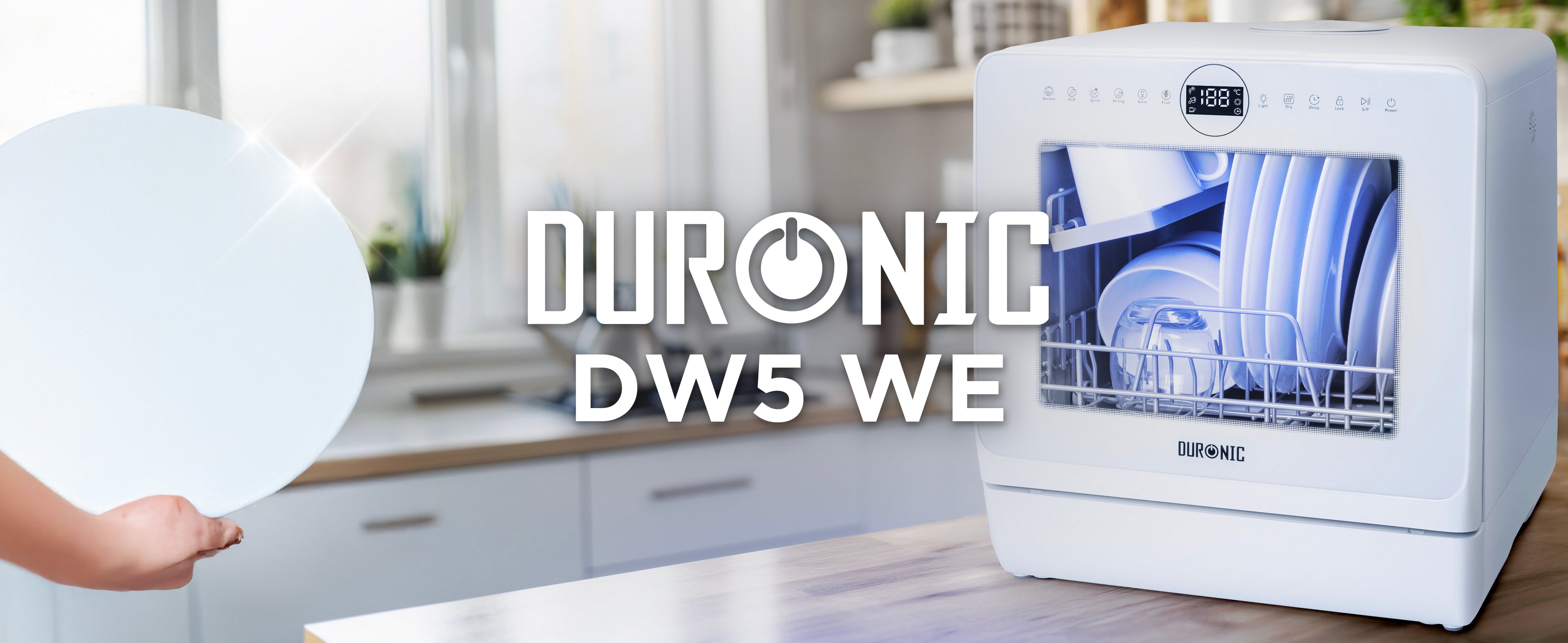 Aesthetic kitchen countertop with the Duronic DW5 WE compact white dishwasher cleaning dishes