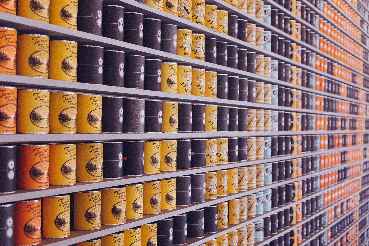 Canned food in tins on shelf to be opened using the Duronic electric can opener