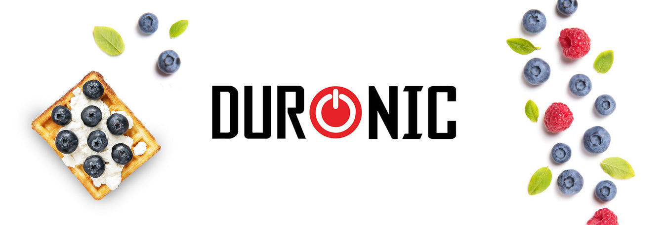 Blueberry waffles surrounded by blueberries and raspberries made using the Duronic electric waffle maker