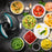 Duronic 2-in-1 Mini Food Processor and Chopper next to bowls of hummus, guacamole, salsa, pesto, and various dipping sauces.