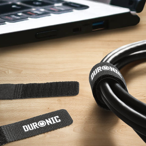 Duronic Cable Ties organizing thick black cords neatly on a wooden desk near a laptop.