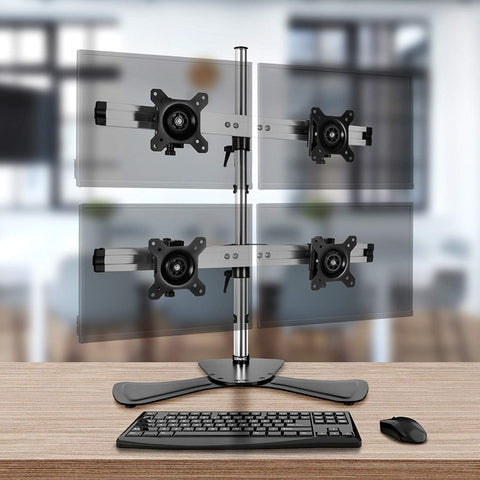 Duronic Computer Monitor Arms holding four screens in a 2x2 configuration on a desk.