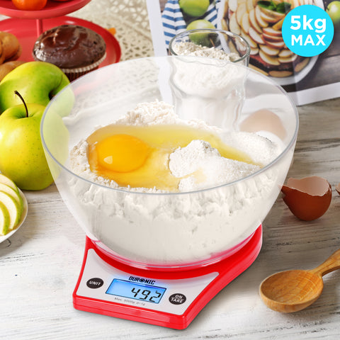 Duronic Digital Kitchen Scale weighing flour and a raw egg inside a large bowl