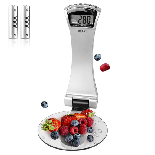 Duronic Digital Kitchen Scale with a glass platform weighing berries, includes two AAA batteries.