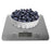 Duronic Digital Kitchen Scales weighing a white bowl piled high with fresh blueberries.