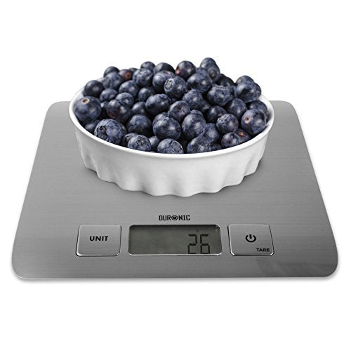 Duronic Digital Kitchen Scales weighing a white bowl piled high with fresh blueberries.