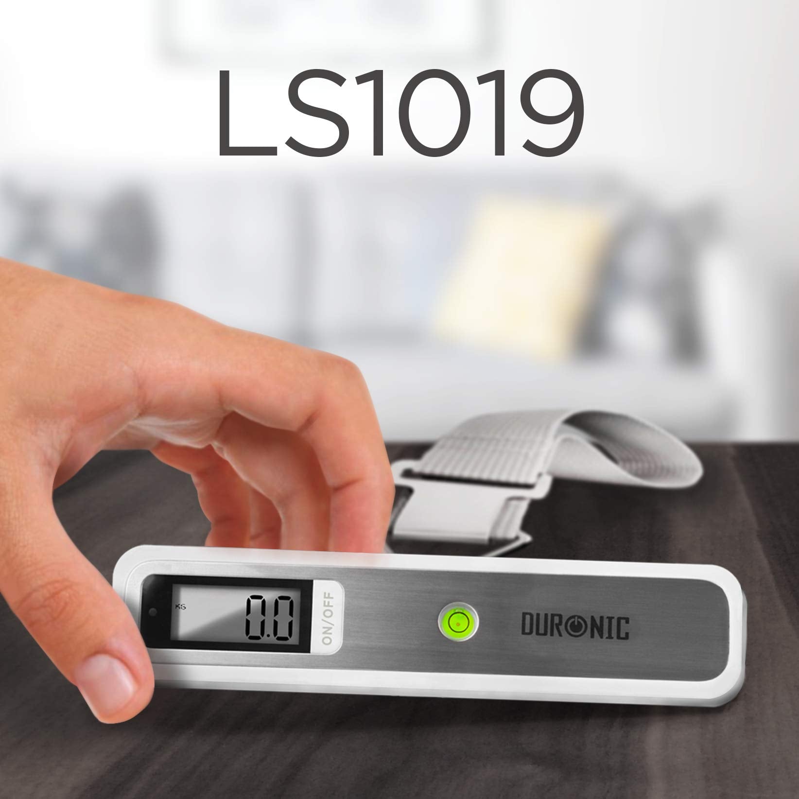 Duronic Digital Luggage Scales with strap, showing zero on display, held by a hand.