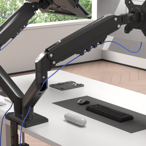 Duronic Dual Monitor Stand Black dual monitor desk mount with cable management, securely clamped to a white desk