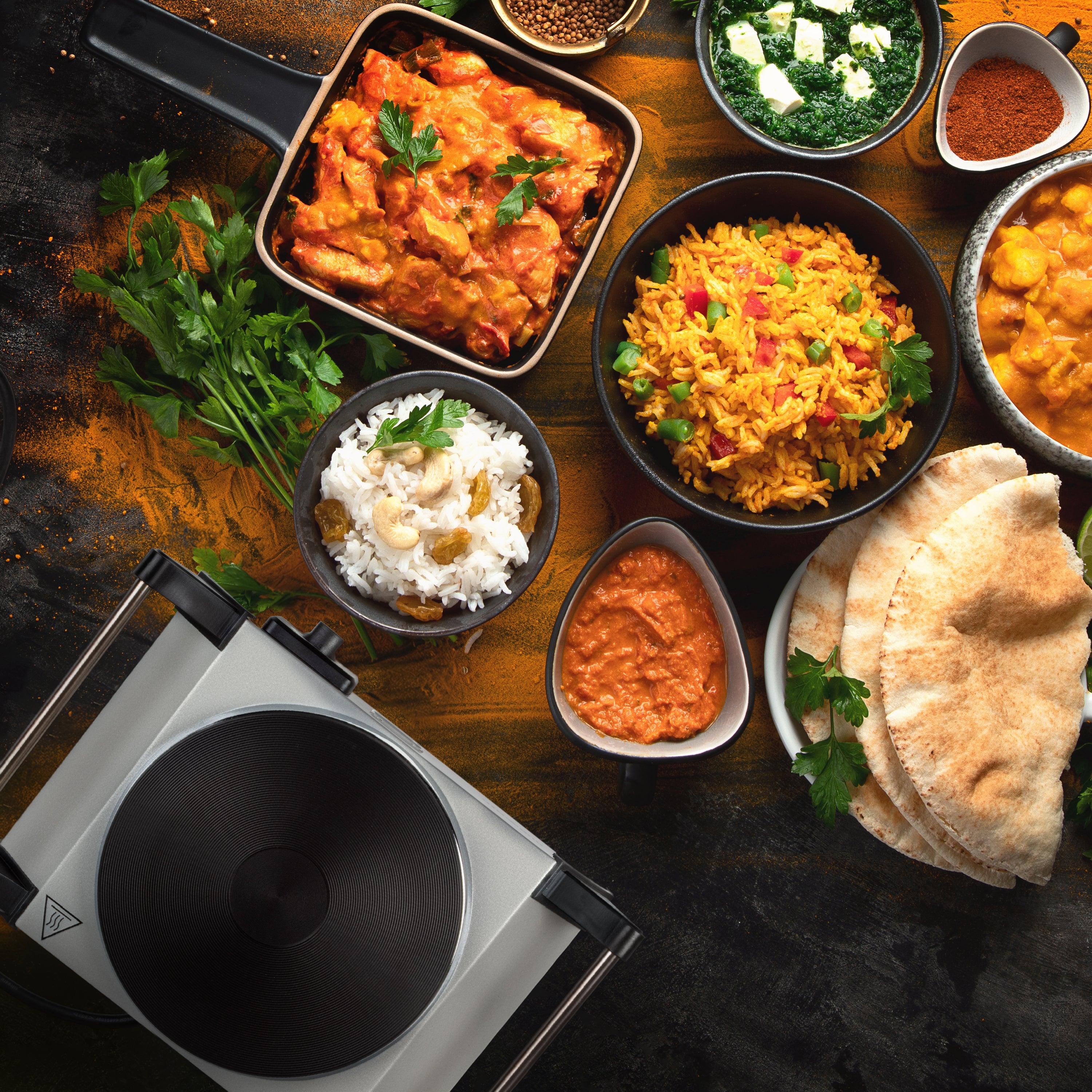 Duronic Electric Hot Plate with Indian dishes, rice, naan bread, and spices
