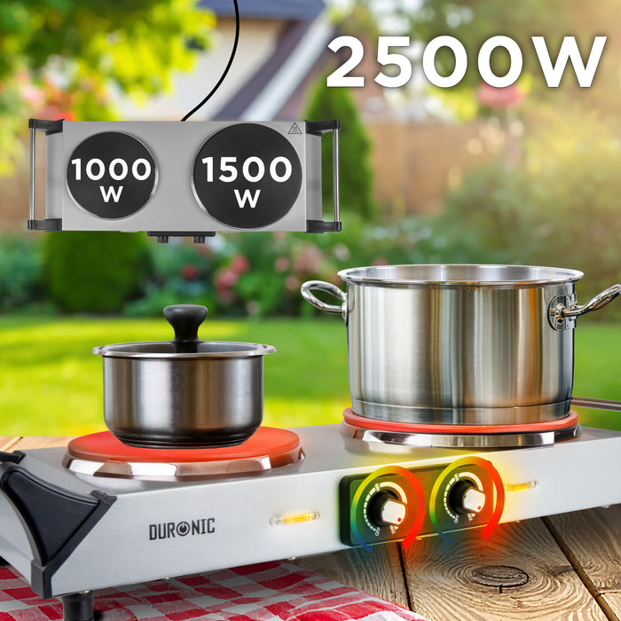 Duronic Electric Hot Plate with pots outdoors on a wooden table.