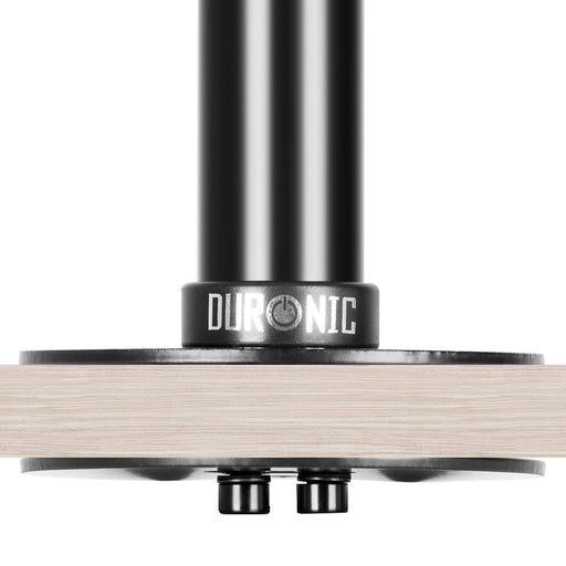 Duronic Grommet securely clamped to a light wood desk surface.