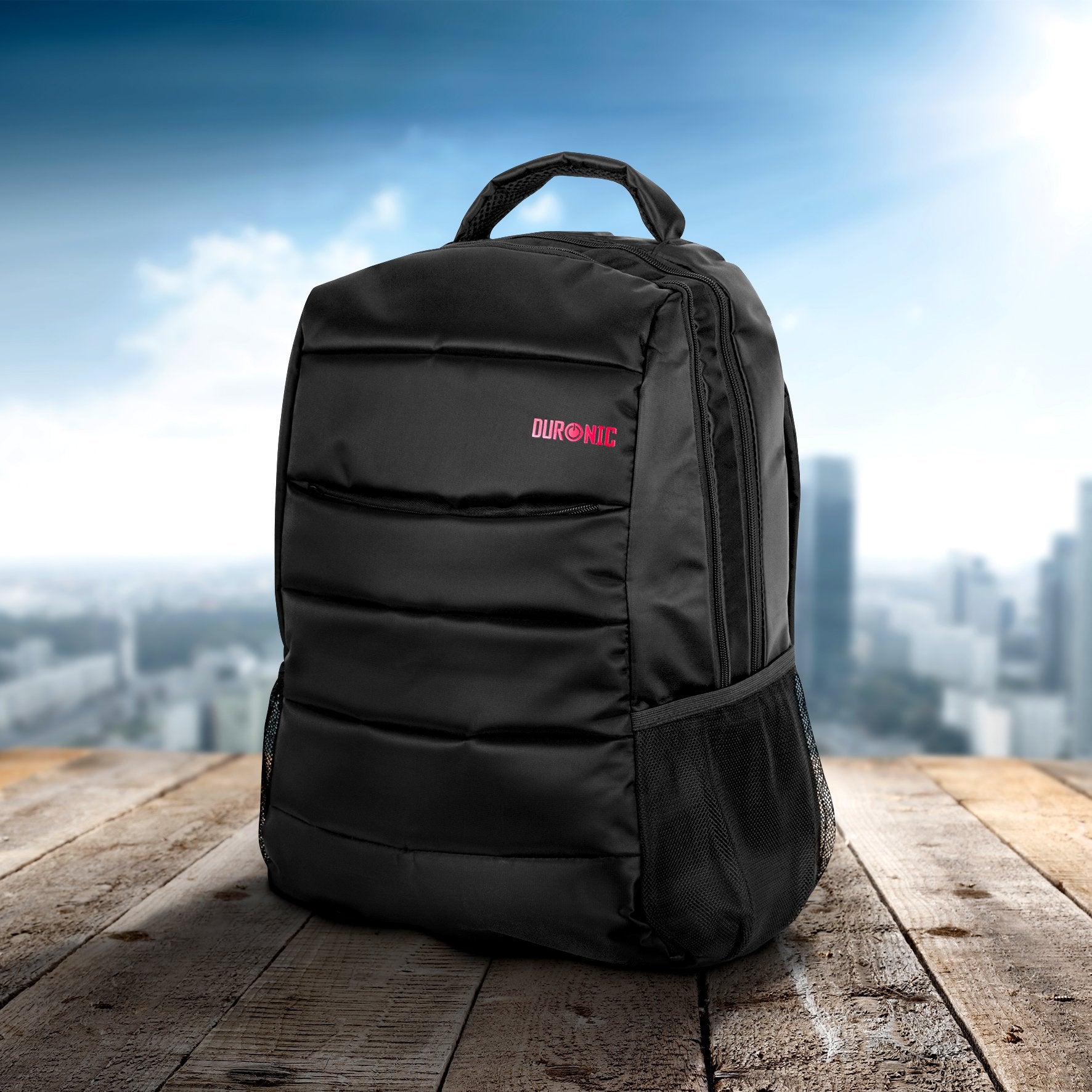 Duronic Laptop Backpack Black with mesh side pockets on a wooden surface against a cityscape.