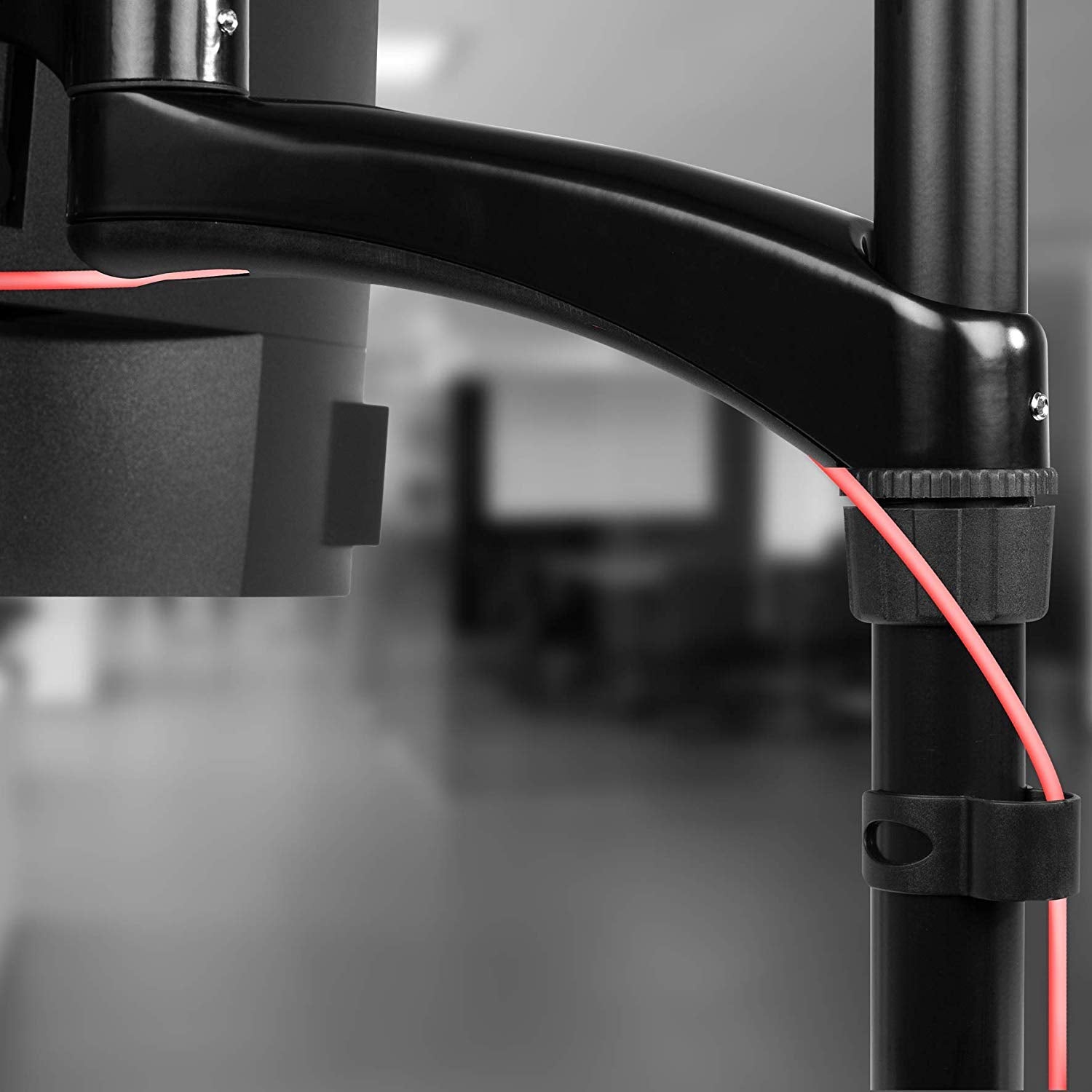 Duronic Monitor Arm Stand featuring integrated red cable management clips.