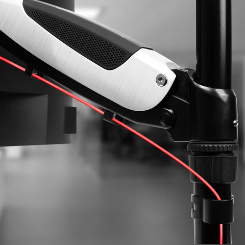 Duronic Monitor Arm Stand showing built-in cable management with a red wire.