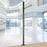 Duronic Monitor Stand Pole mount on a base inside a modern office lobby.