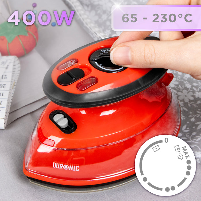 Duronic Red Travel Iron with an adjustable temperature dial ranging from 65°C to 230°C, shown next to sewing supplies.