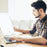 Duronic Sad Light with a man using a laptop at his desk