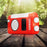 Duronic Solar Radio, HYBRID sitting on a wooden table outdoors in nature.