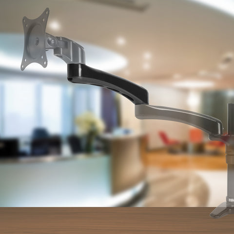Duronic Spare Monitor Arm clamped onto a wooden desk surface.