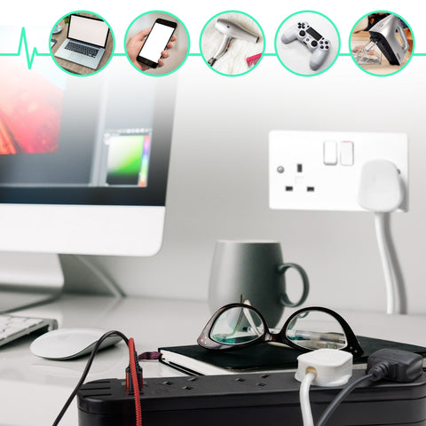 Duronic Tower Extension Lead with computer, glasses, coffee mug, and extension cord powering various electronics.