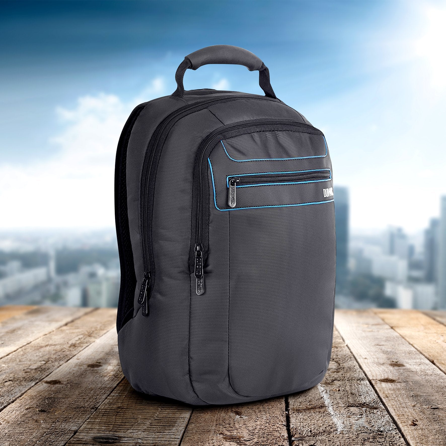 Duronic Travel Laptop Backpack with blue trim and multiple zipper compartments on a wooden table.