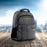 Duronic Travel Laptop Backpack with yellow accents on a wooden table, featuring a city skyline background.