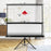 Duronic Tripod Projector Screen on a tripod stand extending upwards in a modern living room setting.