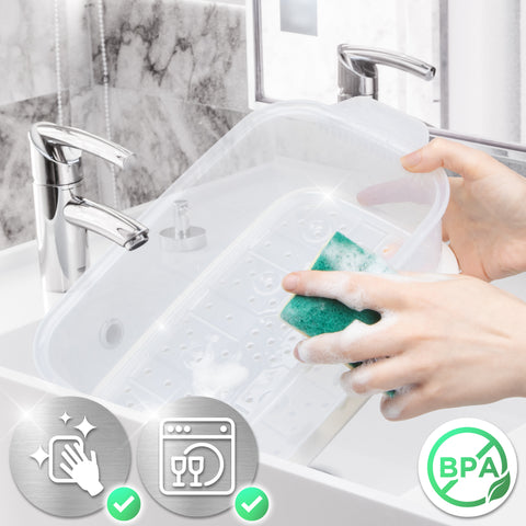 Duronic WE White Electric Food Steamer with a soapy sponge in a white sink.