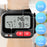 Duronic Wrist Blood Pressure Monitors displaying systolic, diastolic, and pulse readings on a digital screen.