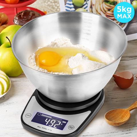 Duronic Digital Kitchen Scale with stainless steel mixing bowl weighing flour and an egg, 5kg maximum.