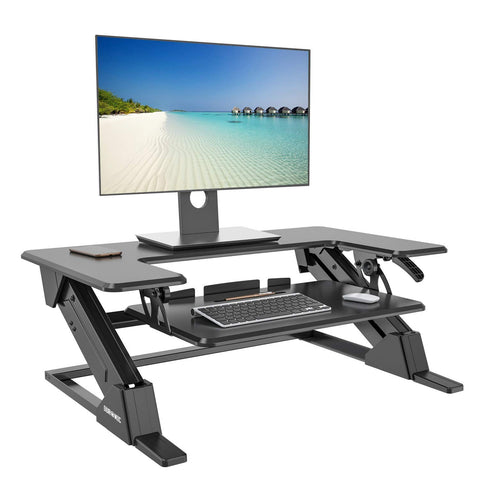 Duronic Sit-Stand Desk with a monitor, keyboard, and mouse on a dual-tier workstation.