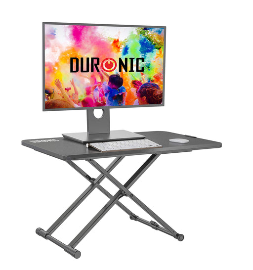 Duronic Sit-Stand Desk with a monitor, keyboard, and mouse on a black desktop.