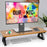 Duronic Monitor Stand Riser with black legs, holding a computer screen on a white desk.