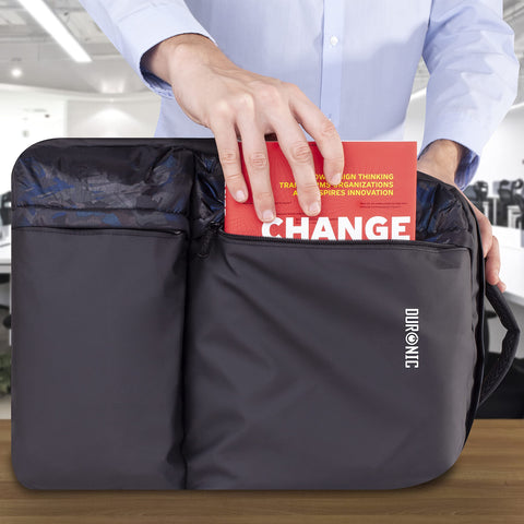 Duronic Laptop Backpack with Person sliding a red book into the front pocket of a black Duronic laptop bag.