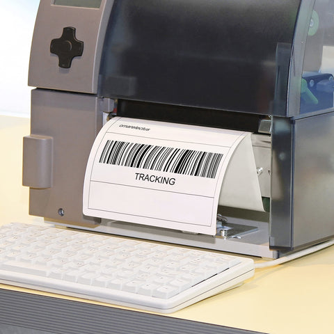 Duronic Thermal Labels thermal label printer sits on a desk next to a white keyboard, currently printing a shipping label featuring a barcode and the word "TRACKING."