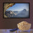 A large bowl of popcorn and a remote control sitting in front of a wall-mounted TV screen.
