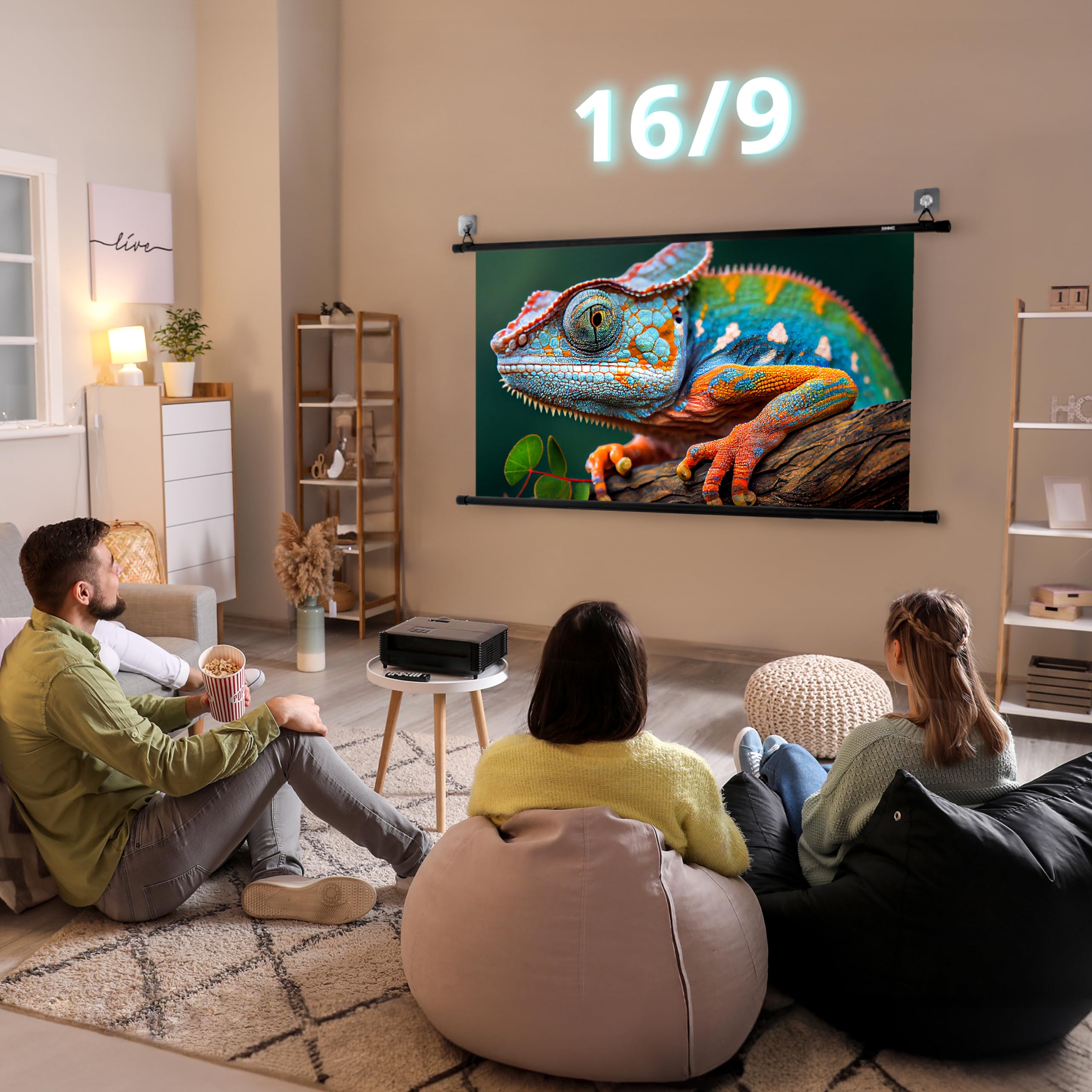 Duronic Bar Projector Screen with A group of people sitting on bean bags in a cozy living room, watching a vibrant chameleon on a wall-mounted 16:9 projector screen.