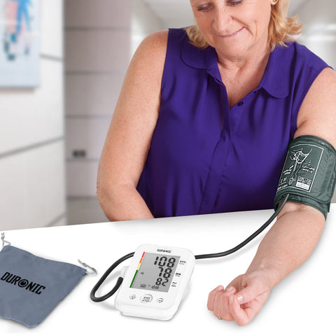 Duronic Blood Pressure Monitor used by a woman to monitor blood pressure
