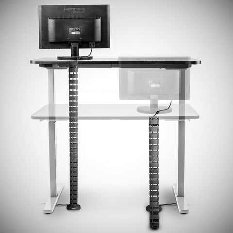 Duronic Cable Management Spine attached to an adjustable standing desk, demonstrating how it neatly organizes cords in both seated and standing positions.