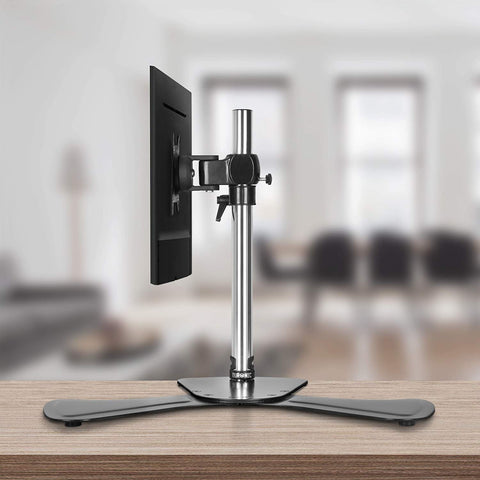 Duronic Computer Monitor Arms Stand with a black base, silver pole, and mounted flat-screen display.