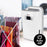 Duronic Dehumidifier with a digital display and auto-off feature stands next to a drying rack of clothes to demonstrate its laundry-drying capabilities.