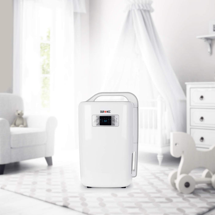 Duronic Dehumidifier with a digital display and integrated carry handle, shown in a bright and airy nursery setting.