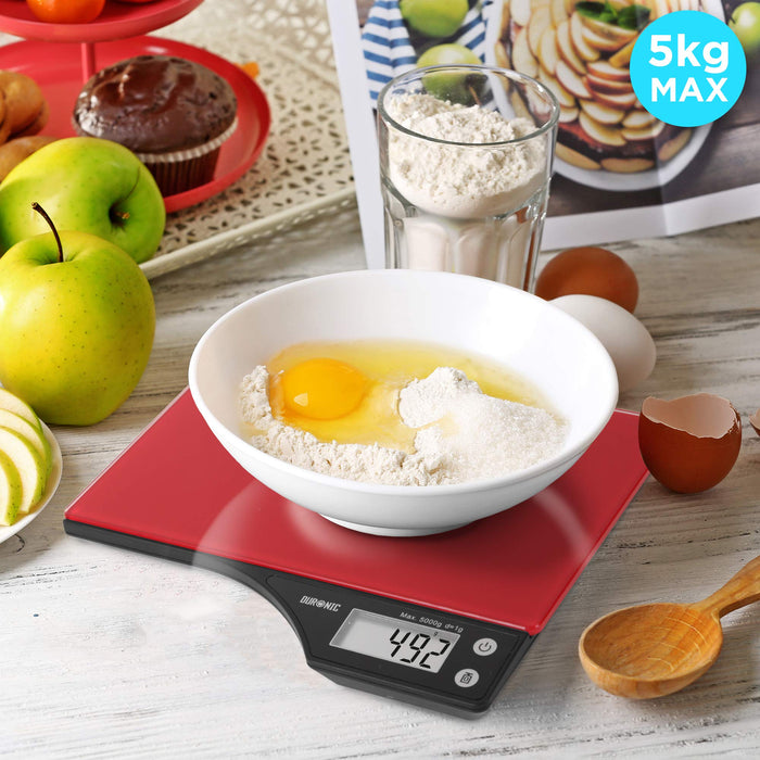 Duronic Digital Kitchen Scales weighing a white bowl of flour and eggs on a wooden table.
