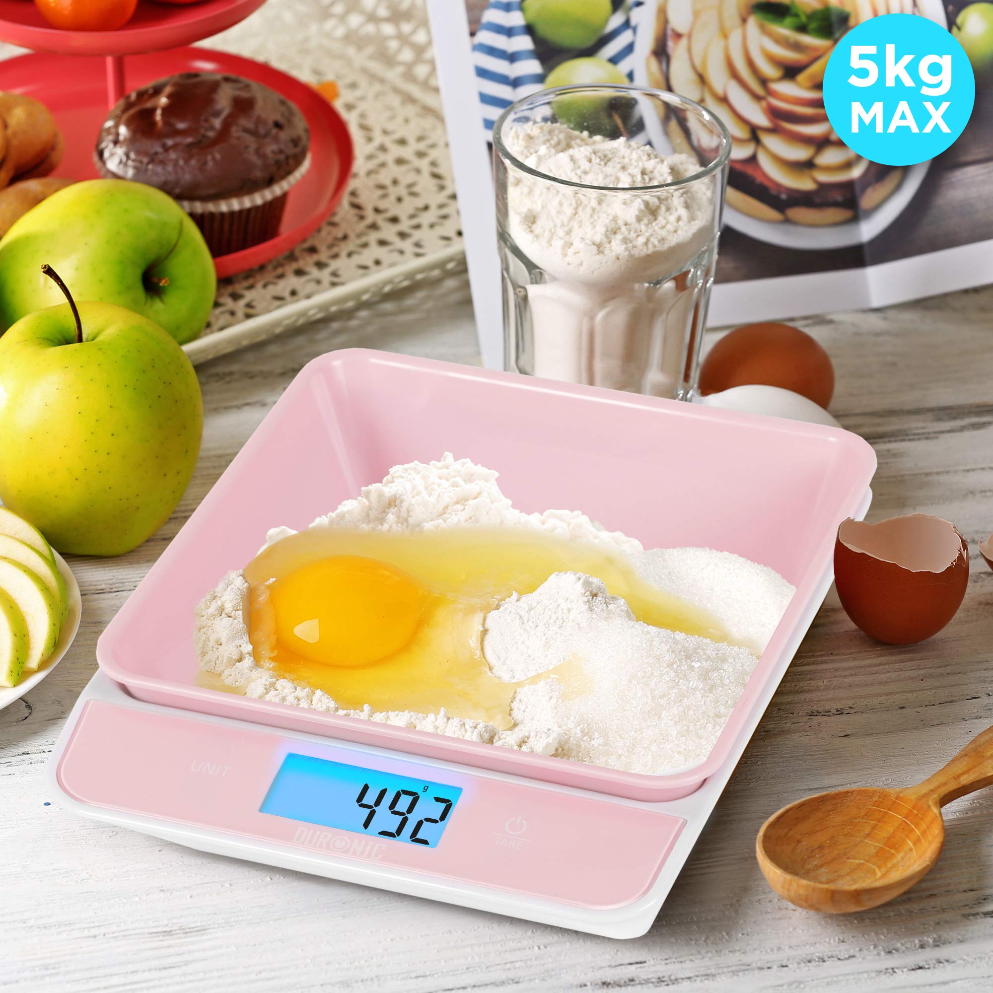 Duronic Digital Kitchen Scales weighing flour and a raw egg, reading 492 grams, 5kg capacity.